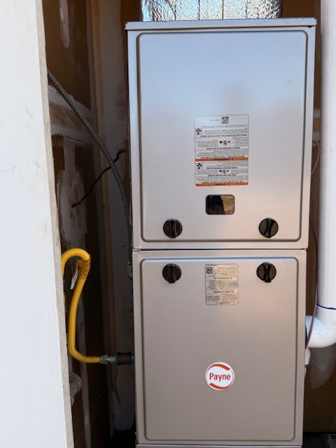 Modern furnace installed in exterior closet after replacement